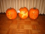The three Apple Pumpkins. From left to right: iSync icon, Clarus the Dog Cow ("Moof!"), Finder icon